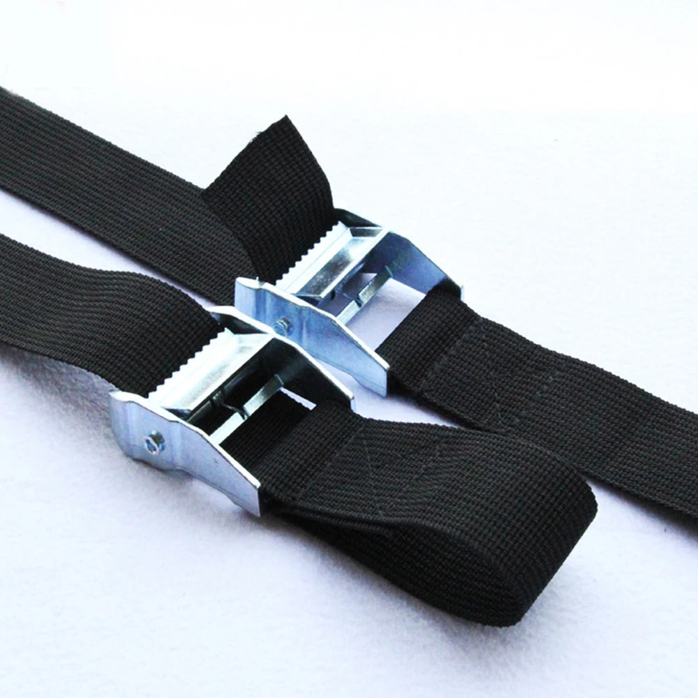 two black cargo tie down straps side by side