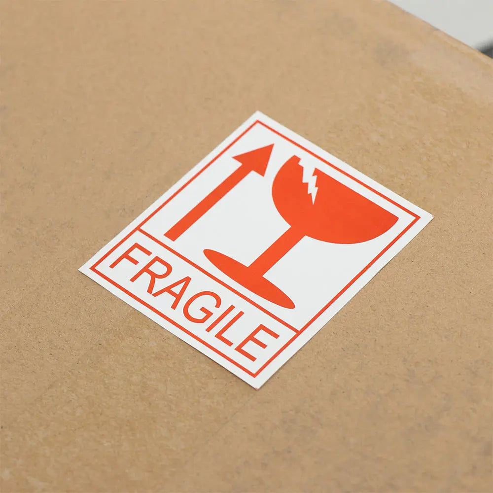 close up of fragile warning label on box