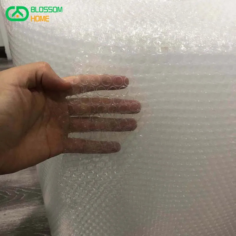 a hand touching bubble wrap